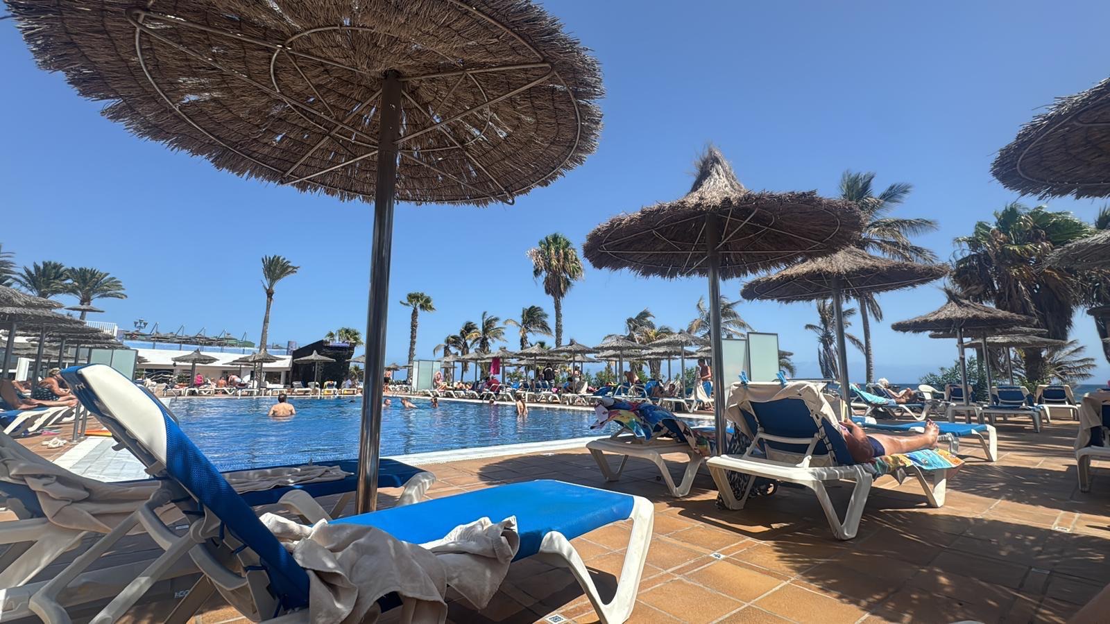 Sun loungers and umbrellas beside the pool